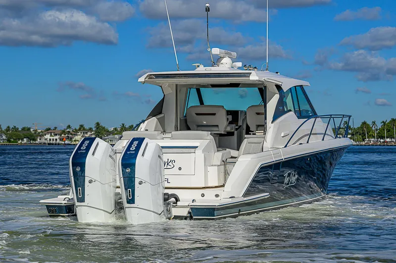 Slide: The Image of 2023 Tiara Yachts 43 LE cruising on a sunny day with twin engines. - 7