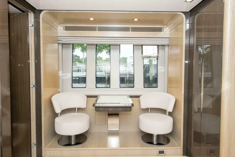 Slide: The Image of Luxurious interior of 2017 Azimut 84 Flybridge yacht with modern seating and windows. - 14