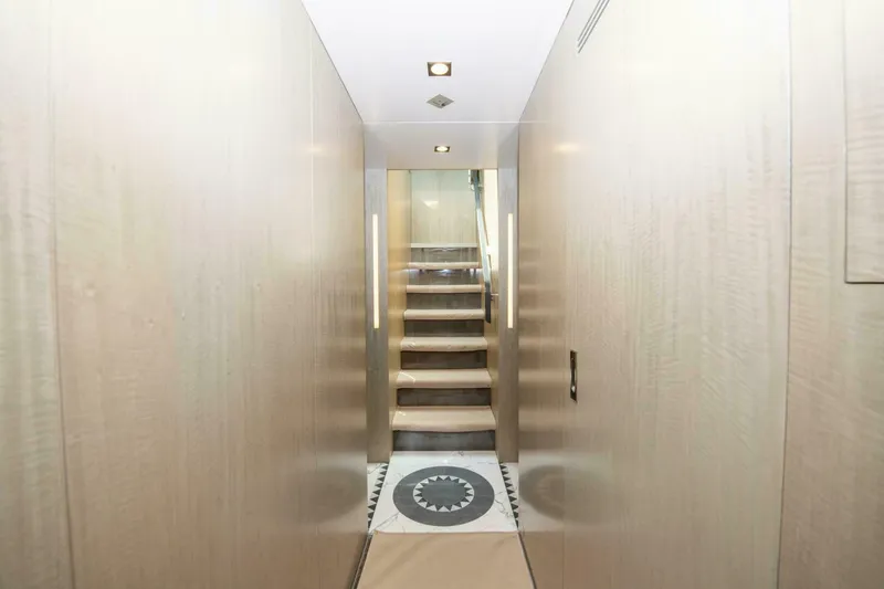 Slide: The Image of Interior hallway of 2017 Azimut 84 Flybridge yacht with modern wooden staircase. - 19