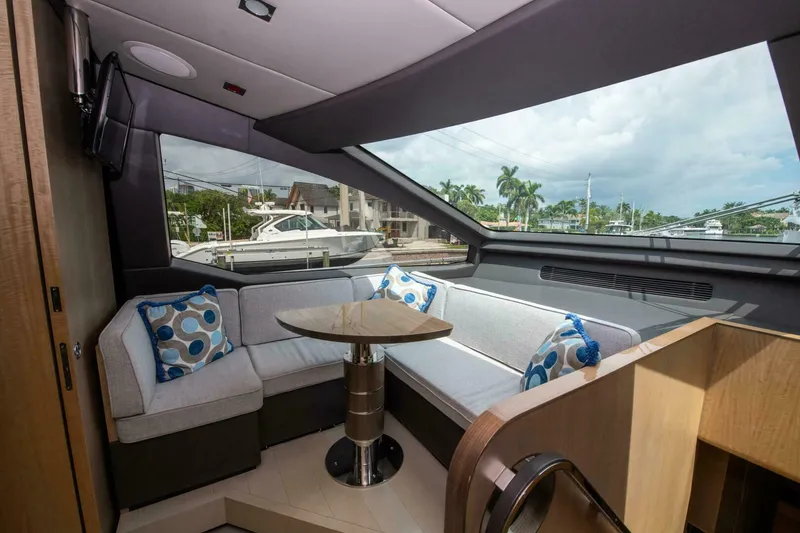 Slide: The Image of Luxurious interior of 2017 Azimut 84 Flybridge yacht with plush seating and scenic view. - 21