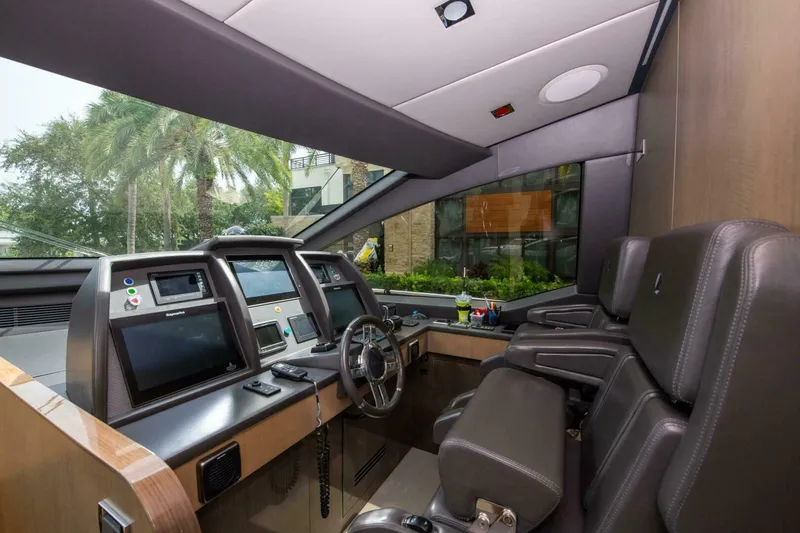 Slide: The Image of Luxurious 2017 Azimut 84 Flybridge yacht cockpit with modern navigation equipment and plush seating. - 22