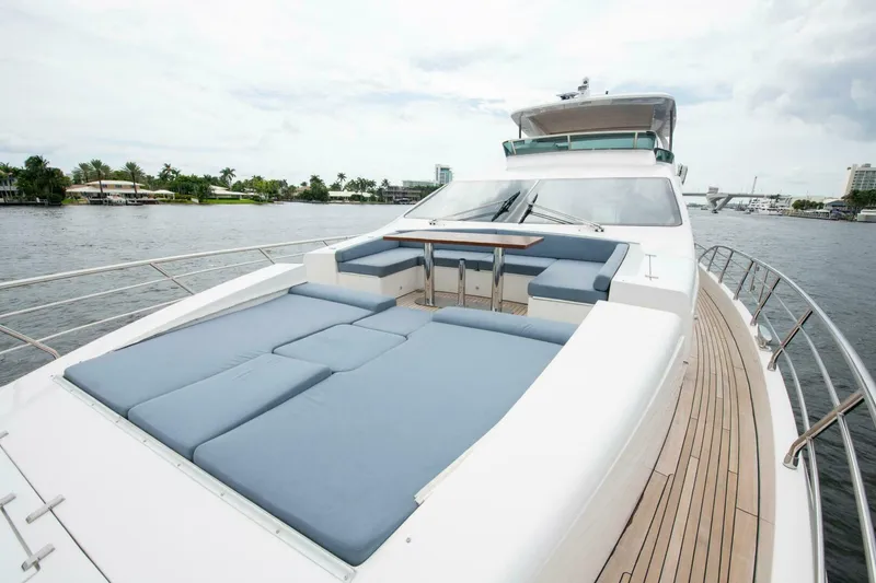 Slide: The Image of Azimut 84 Flybridge 2017 yacht with spacious deck and seating area on the water. - 30