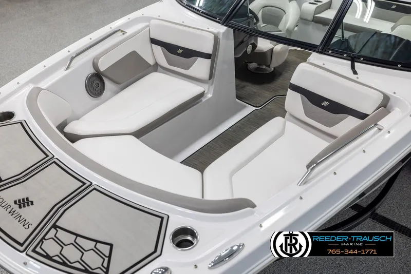Slide: The Image of 2019 Four Winns HD200 boat interior with white seating and logo details. - 10