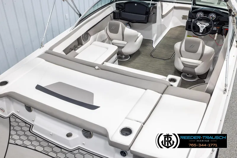 Slide: The Image of 2019 Four Winns HD200 boat interior with plush seating and modern dashboard. - 12