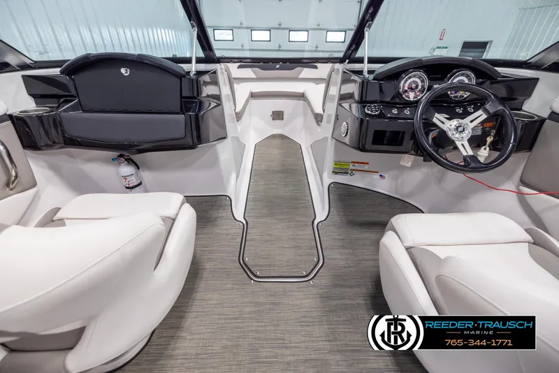 Slide: The Image of 2019 Four Winns HD200 boat interior with modern dashboard and seating. - 14