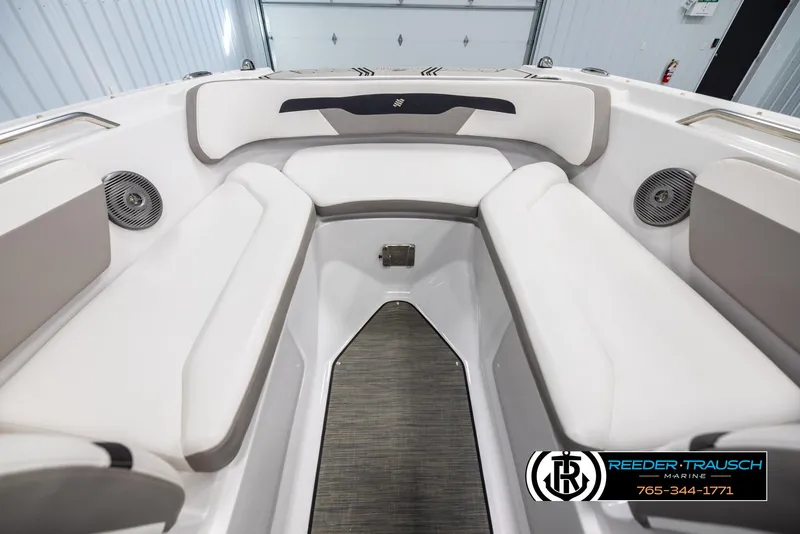 Slide: The Image of 2019 Four Winns HD200 boat interior with white seating and speakers. - 15