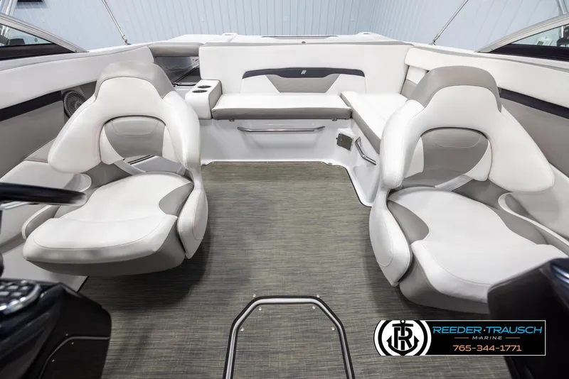 Slide: The Image of 2019 Four Winns HD200 boat interior with white seating and carpeted flooring. - 17