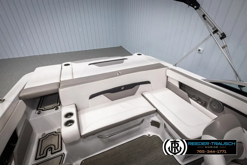 Slide: The Image of 2019 Four Winns HD200 boat interior with white seating and cup holders. - 21