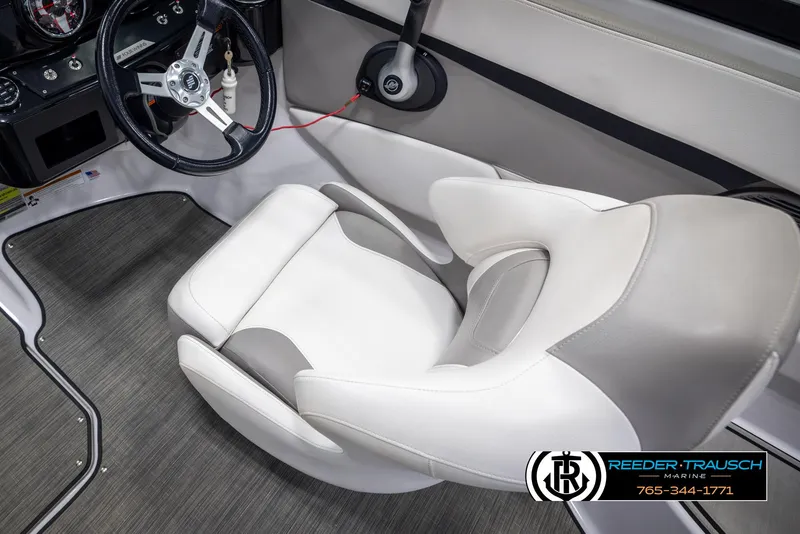 Slide: The Image of Interior of 2019 Four Winns HD200 boat with steering wheel and seating. - 25