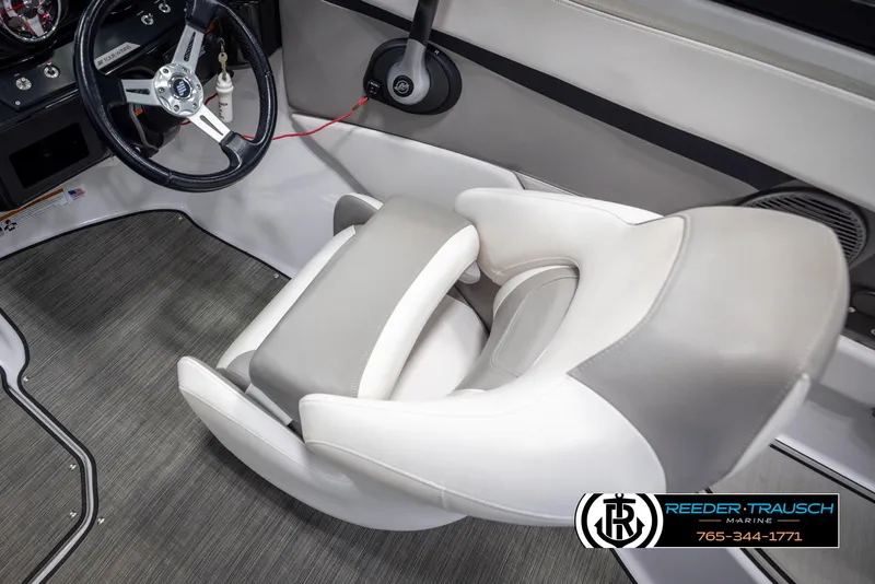 Slide: The Image of 2019 Four Winns HD200 boat interior with steering wheel and seating. - 26