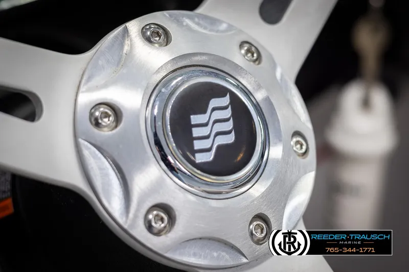 Slide: The Image of Close-up of 2019 Four Winns HD200 steering wheel with logo. - 29