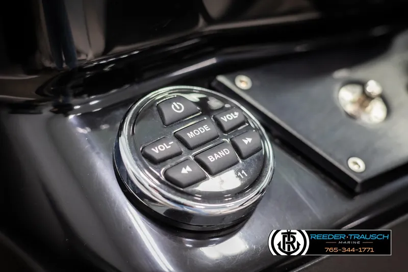 Slide: The Image of Control panel on 2019 Four Winns HD200 boat dashboard with volume and mode buttons. - 30