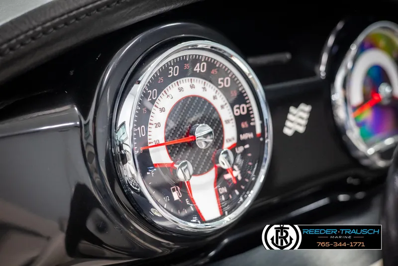 Slide: The Image of 2019 Four Winns HD200 dashboard with speedometer and tachometer close-up. - 32