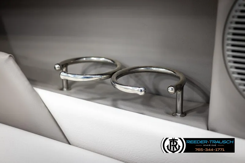 Slide: The Image of 2019 Four Winns HD200 boat cup holders, sleek metal design, interior detail. - 38