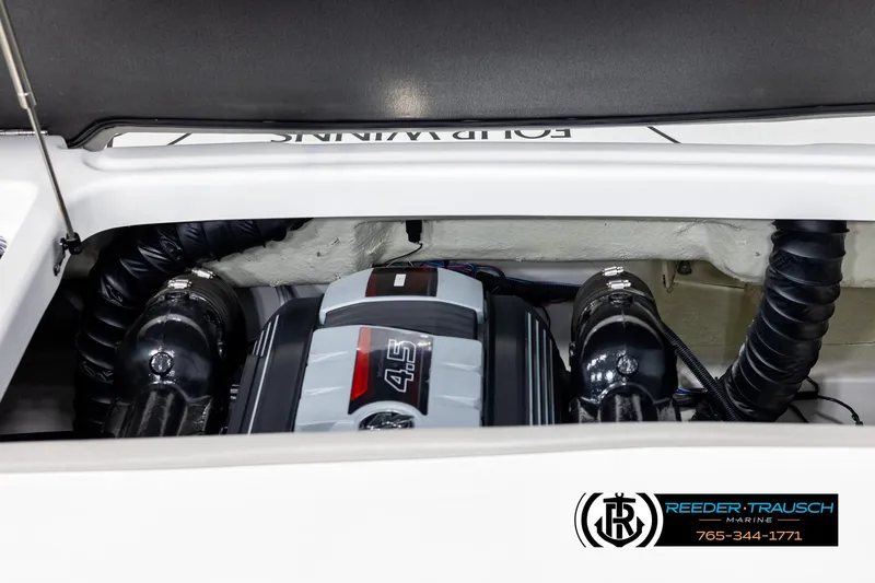 Slide: The Image of 2019 Four Winns HD200 engine compartment with visible 4.5L engine components. - 44
