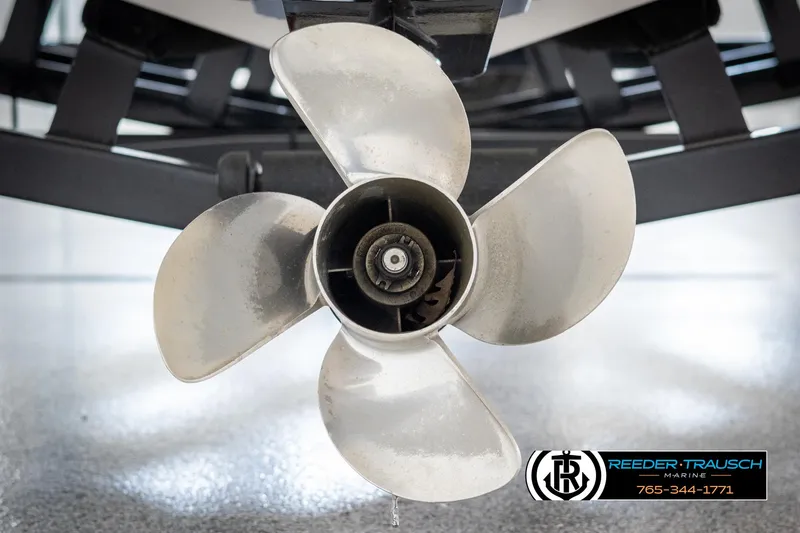 Slide: The Image of 2019 Four Winns HD200 boat propeller close-up with Reeder-Trausch Marine logo. - 49