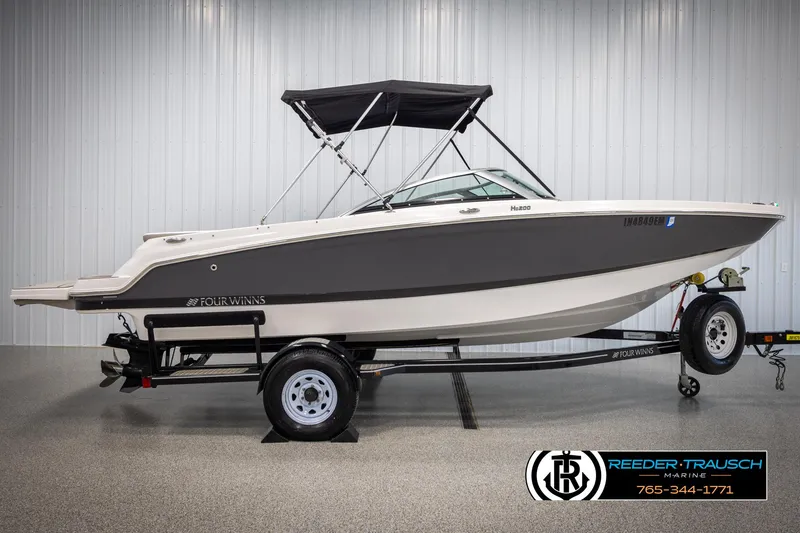 Slide: The Image of 2019 Four Winns HD200 boat on trailer in showroom. - 5