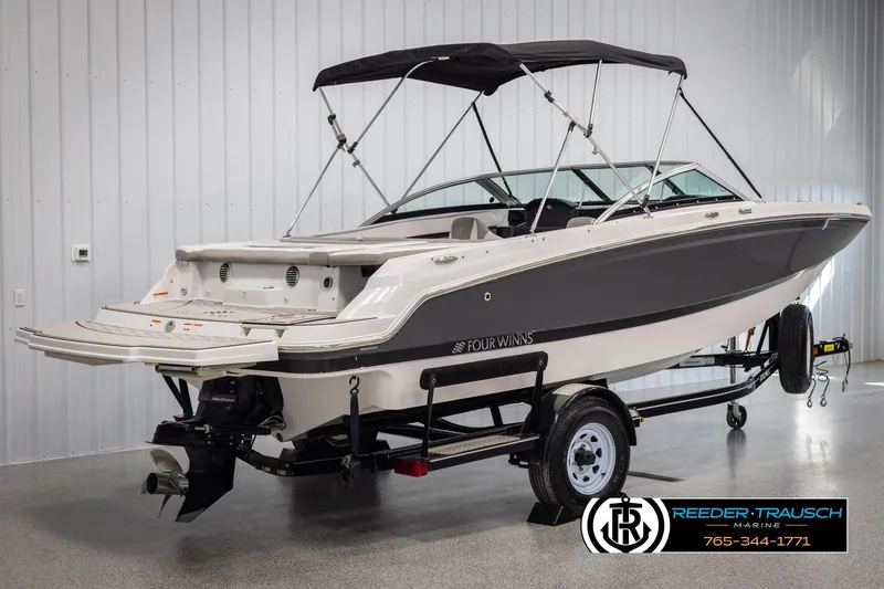Slide: The Image of 2019 Four Winns HD200 boat on trailer in showroom. - 6