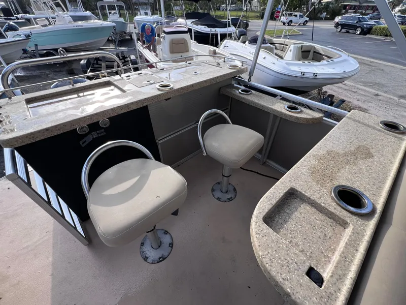 Slide: The Image of 2013 Harris FloteBote Sunliner 220 interior with seating and counter space. - 10