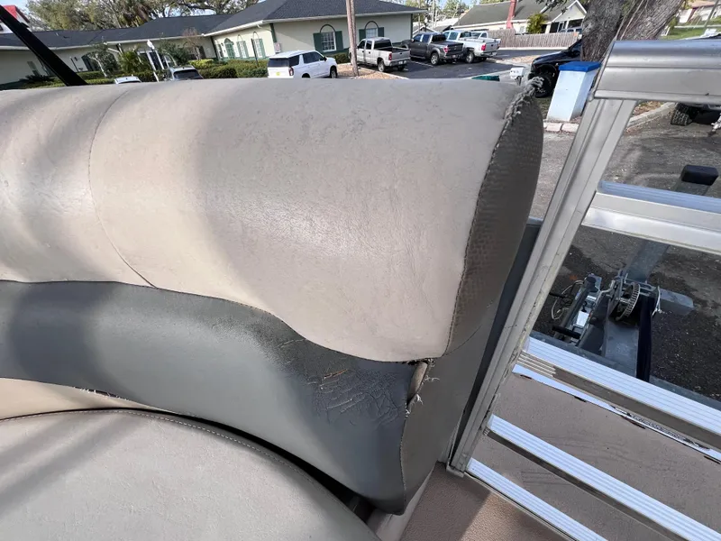 Slide: The Image of 2013 Harris FloteBote Sunliner 220 boat seat with visible wear and tear. - 15