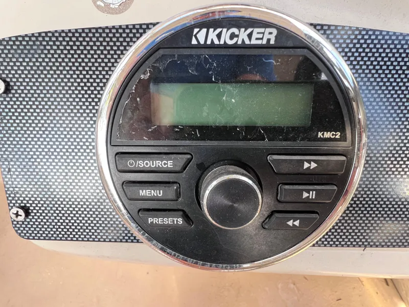 Slide: The Image of Kicker KMC2 audio system on 2013 Harris FloteBote Sunliner 220 boat dashboard. - 22