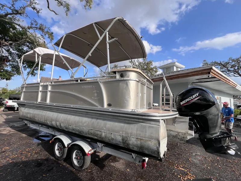 Slide: The Image of 2013 Harris FloteBote Sunliner 220 pontoon boat on trailer with Mercury outboard motor. - 4
