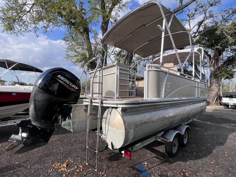 Slide: The Image of 2013 Harris FloteBote Sunliner 220 pontoon boat with Mercury outboard motor on trailer. - 6