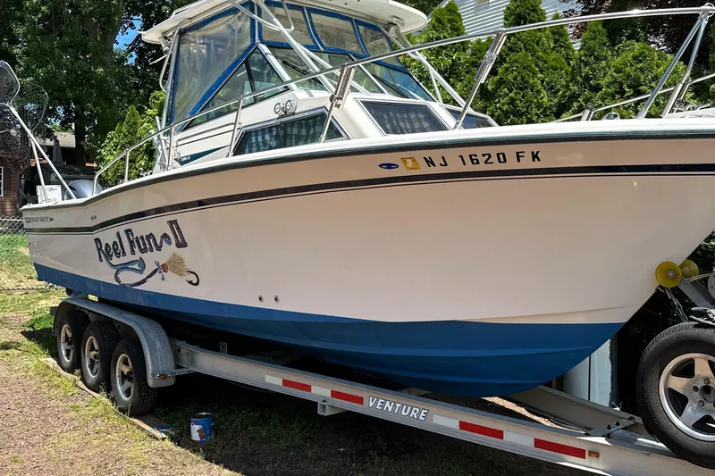 Slide: The Image of 1988 Grady-White 255 Sailfish Walkaround boat on trailer, side view. - 3