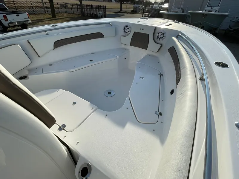 Slide: The Image of 2025 Tidewater 232 SS boat interior with spacious seating and modern design. - 14