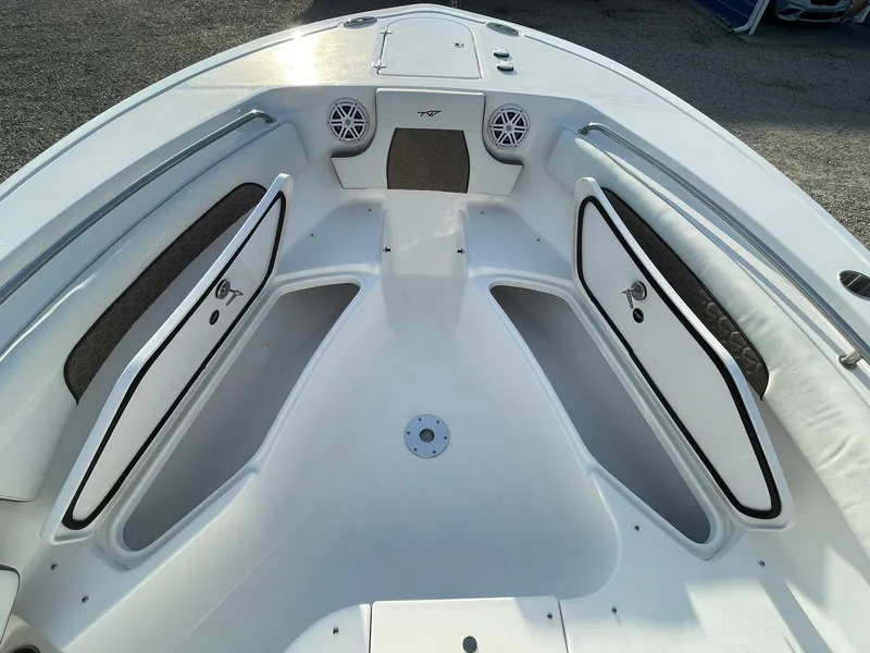 Slide: The Image of 2025 Tidewater 232 SS boat interior with seating and storage compartments. - 15