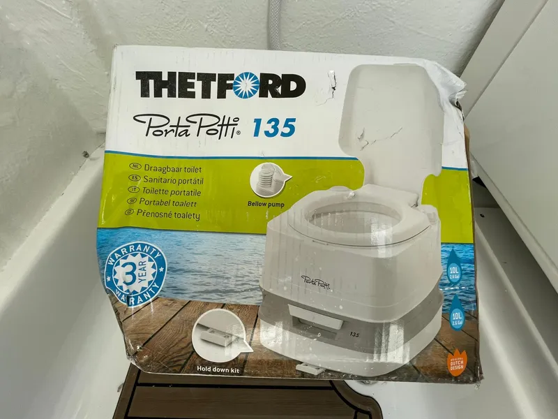 Slide: The Image of Thetford Porta Potti 135 packaging, portable toilet with 3-year warranty, ideal for travel. - 19