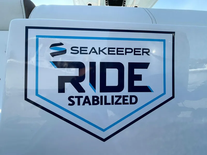 Slide: The Image of 2025 Tidewater 232 SS featuring Seakeeper Ride Stabilized technology logo. - 2