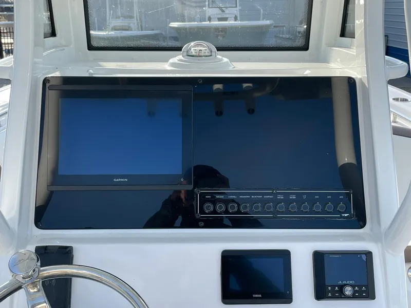 Slide: The Image of Dashboard of 2025 Tidewater 232 SS boat with modern navigation screens. - 21