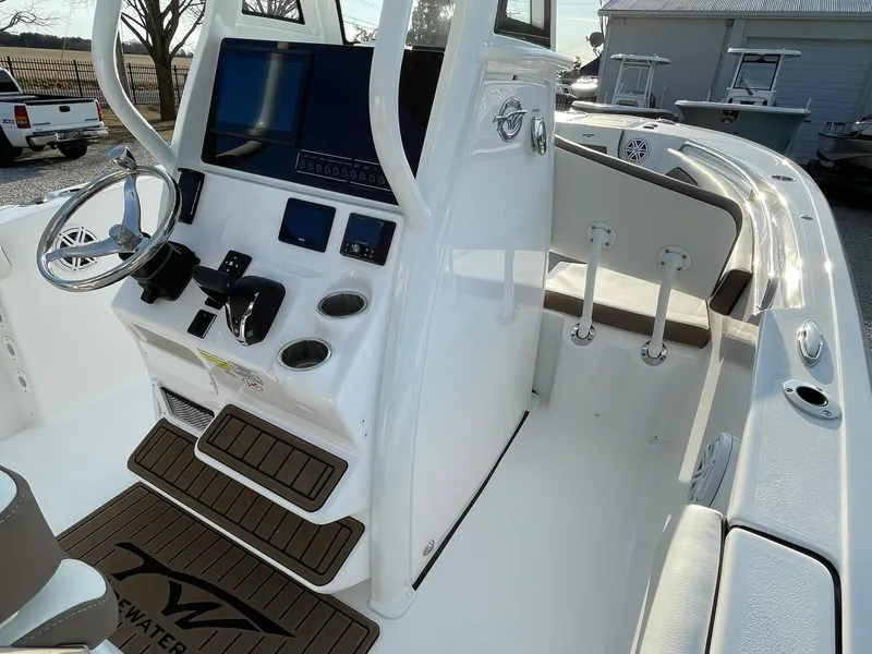 Slide: The Image of 2025 Tidewater 232 SS boat console with modern navigation equipment and controls. - 25