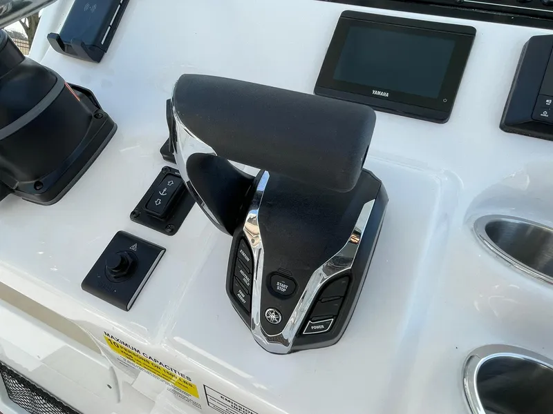 Slide: The Image of 2025 Tidewater 232 SS boat interior with modern console and steering wheel. - 26