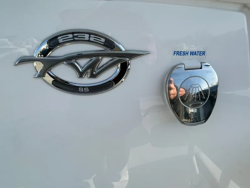 Slide: The Image of Tidewater 232 SS 2025 boat deck with logo and textured flooring. - 30