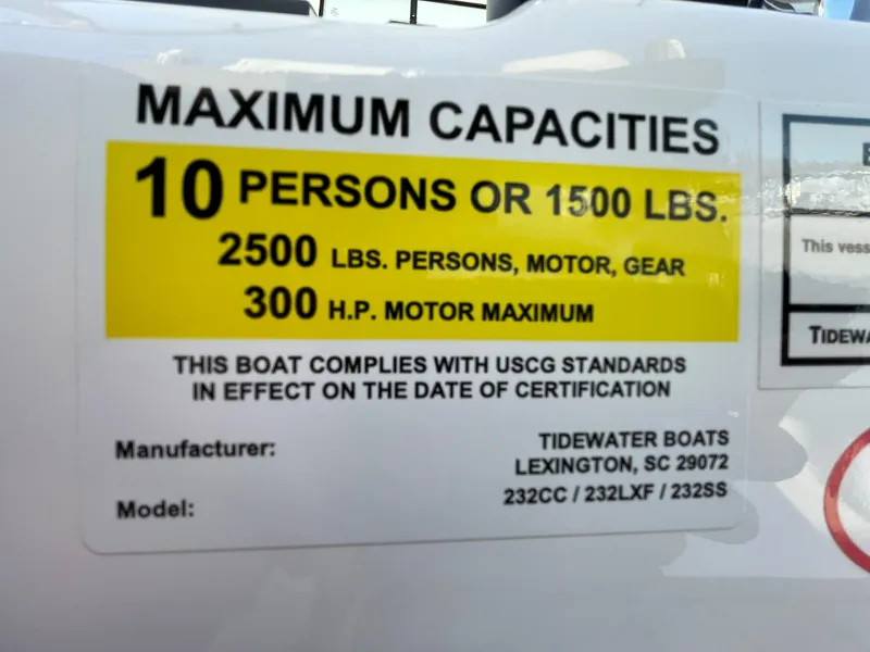 Slide: The Image of 2025 Tidewater 232 SS boat interior with cushioned seating and speakers. - 33