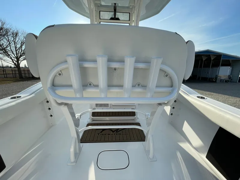 Slide: The Image of 2025 Tidewater 232 SS boat deck with storage compartment and hose attachment. - 49