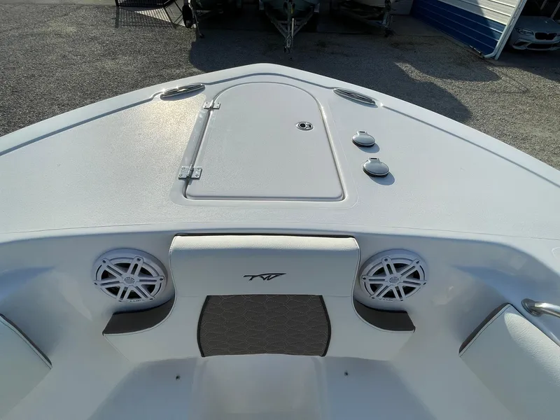 Slide: The Image of 2025 Tidewater 232 SS boat bow with speakers and storage compartment. - 5