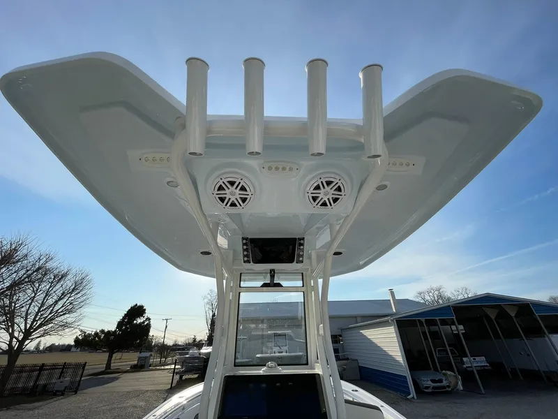Slide: The Image of 2026 Tidewater 232 SS boat interior with rod holders and seating. - 50