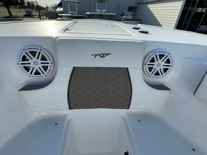 Slide: The Image of 2025 Tidewater 232 SS boat interior with speakers and logo. - 7