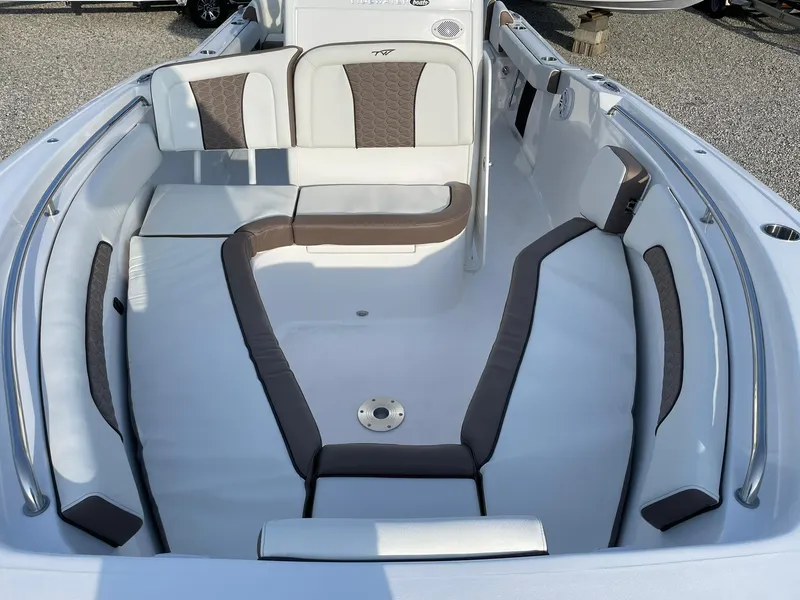 Slide: The Image of 2025 Tidewater 232 SS boat interior with cushioned seating and sleek design. - 8