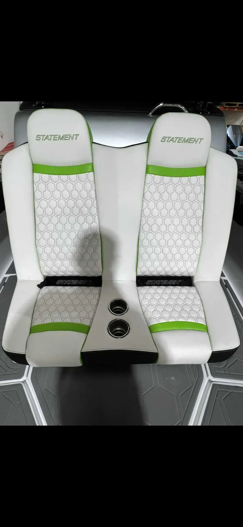 Slide: The Image of 2024 Statement 350 Open boat seats with green accents and cup holders. - 10