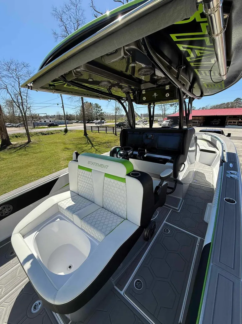 Slide: The Image of 2024 Statement 350 Open boat interior with modern seating and sleek design. - 21