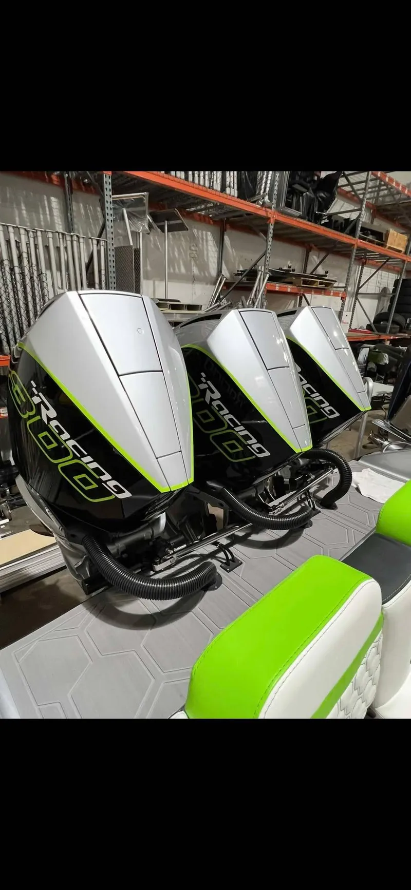 Slide: The Image of 2024 Statement 350 Open boat engines with sleek design and vibrant green accents. - 27