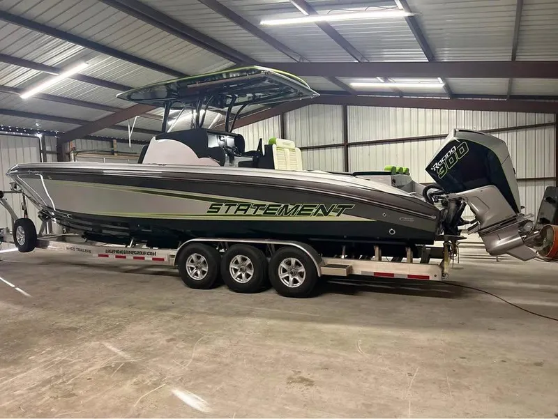 Slide: The Image of 2024 Statement 350 Open boat on trailer in warehouse setting. - 6