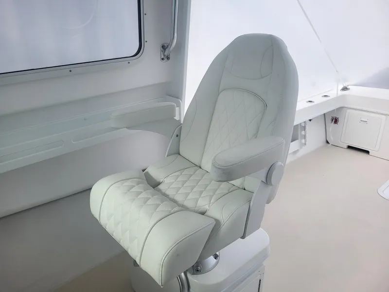 Slide: The Image of Luxurious captain's chair on 2025 Steiger Craft 28 Fisherman boat, featuring quilted upholstery. - 13
