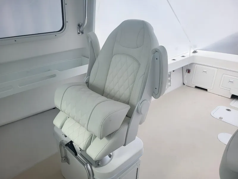Slide: The Image of Luxurious seating on 2025 Steiger Craft 28 Fisherman boat, featuring elegant white upholstery. - 15
