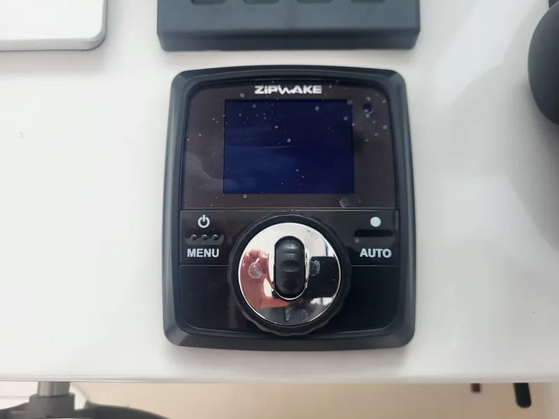 Slide: The Image of Zipwake control panel on 2025 Steiger Craft 28 Fisherman boat dashboard. - 17