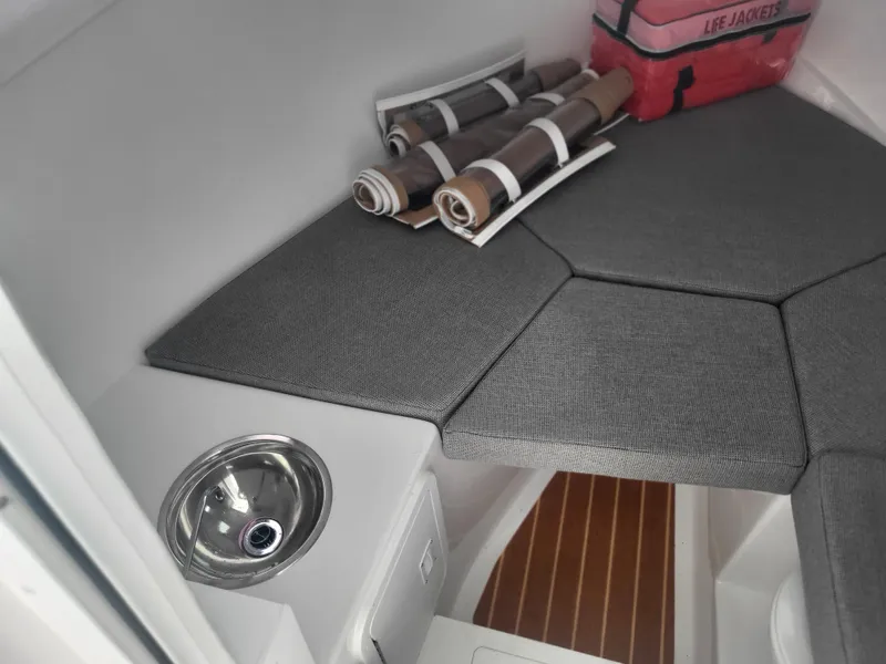 Slide: The Image of 2025 Steiger Craft 28 Fisherman cabin interior with sink and storage. - 30